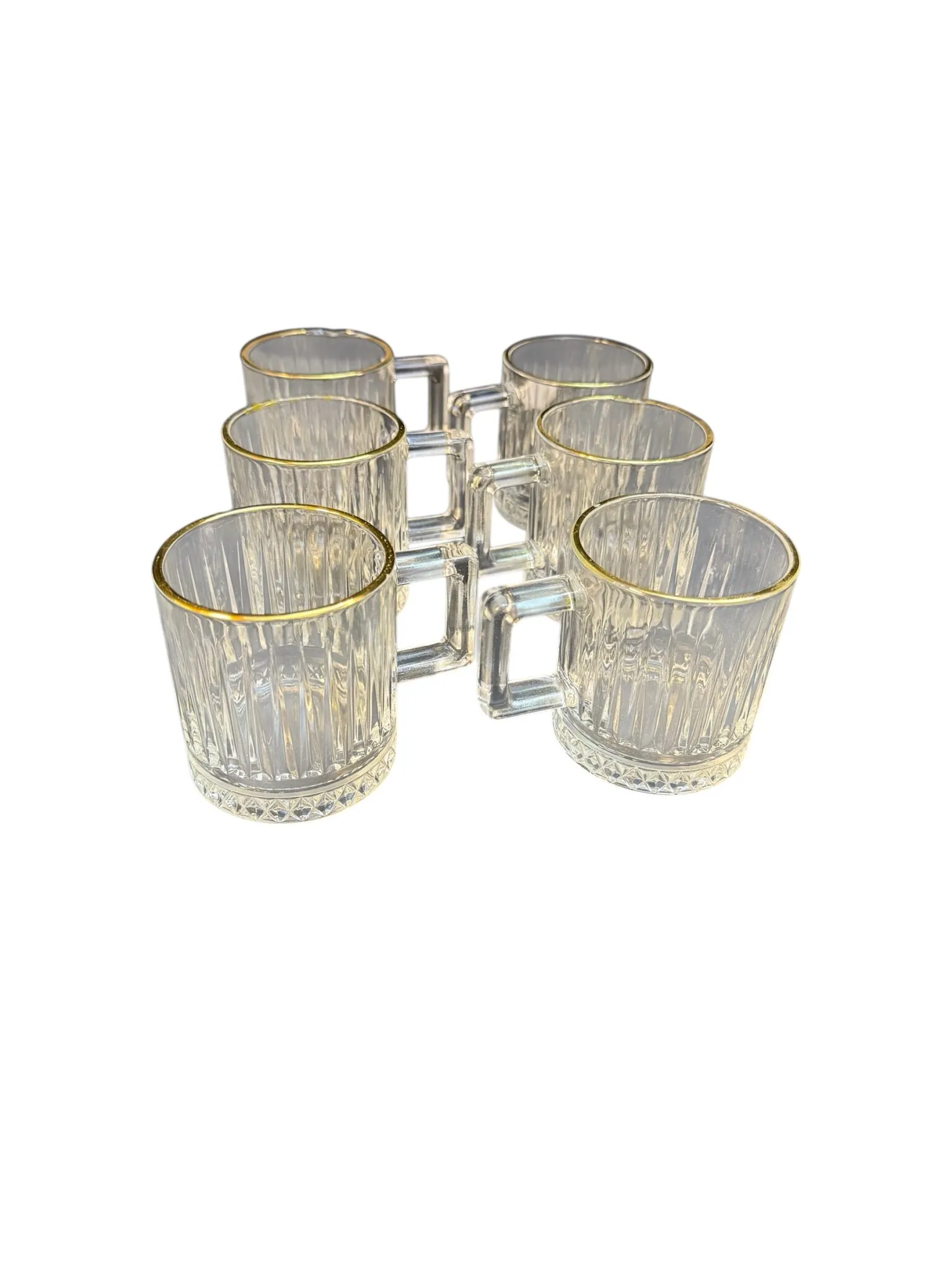 Tassen aus hellem Glas mit Goldrand und Riffeloptik